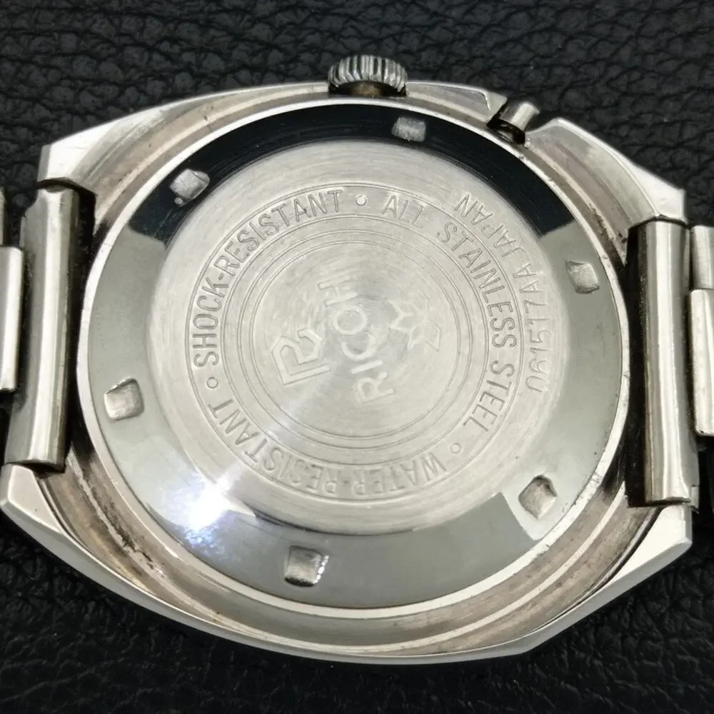 Vintage 1975 Ricoh Automatic Mens Silver Watch W/daydate & Blue accents